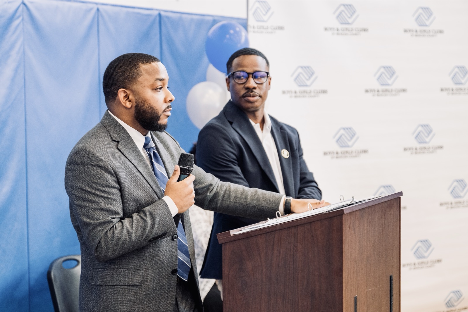 CJ Burnett presenting community work alongside local partners.